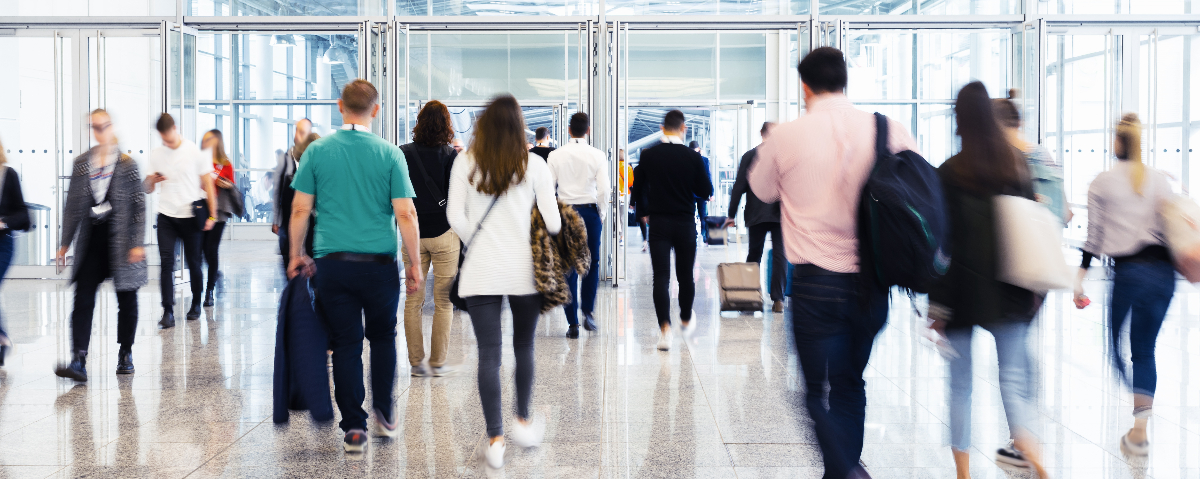 People walking around a trade fair to help illustrate public sector