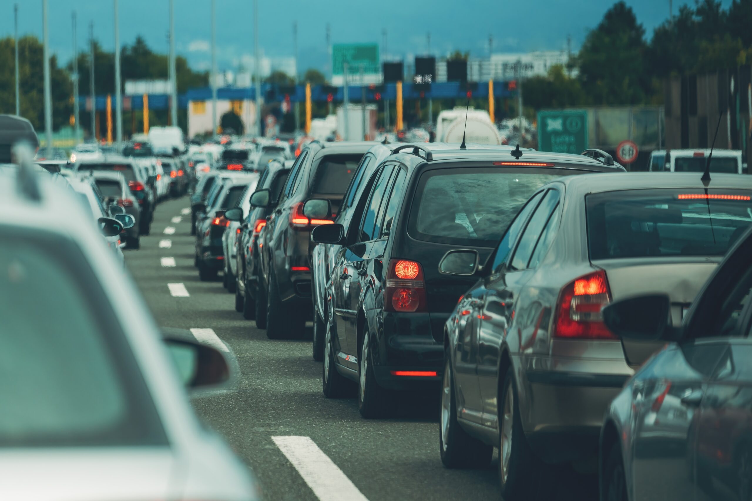 Large,Queue,Of,Vehicles,On,Motorway,Pay,Toll,In,Summer,