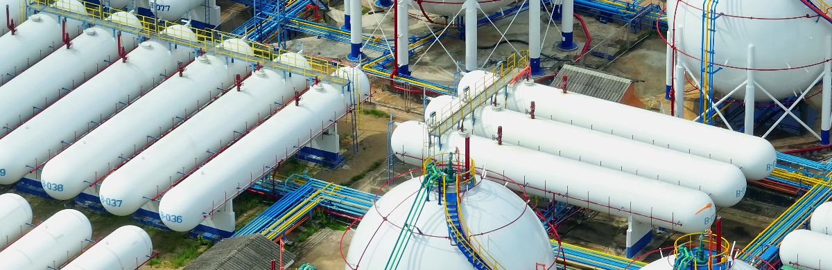 An intricate grid of tanks and pipelines from above for utilities and energy.